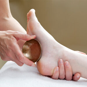 Massage des pieds au bol kansu